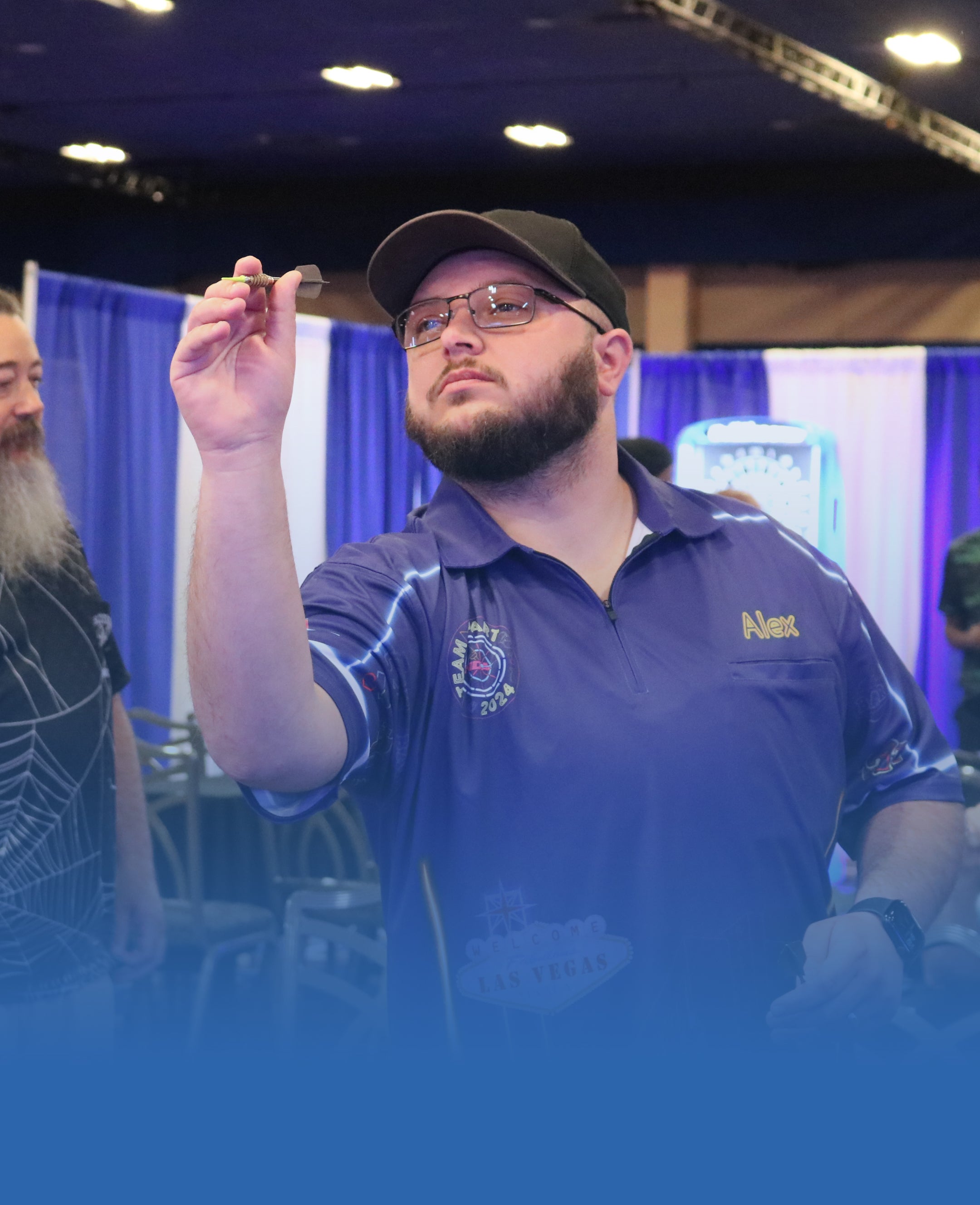 Darts player posing in an NDA Team Dart event jersey from our Ready Designs collection.