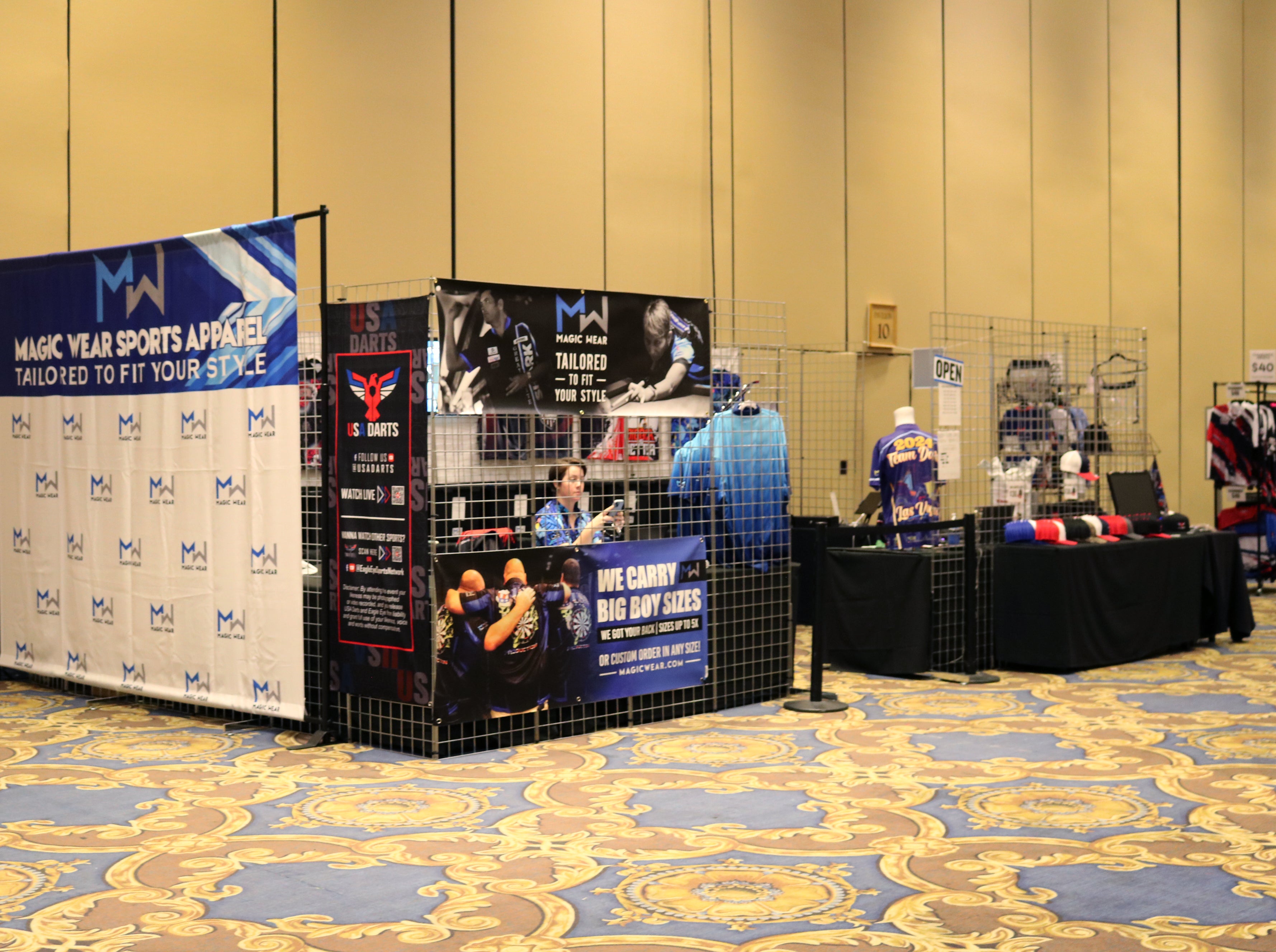 Magic Wear apparel booth during the NDA Team Dart event in Las Vegas.