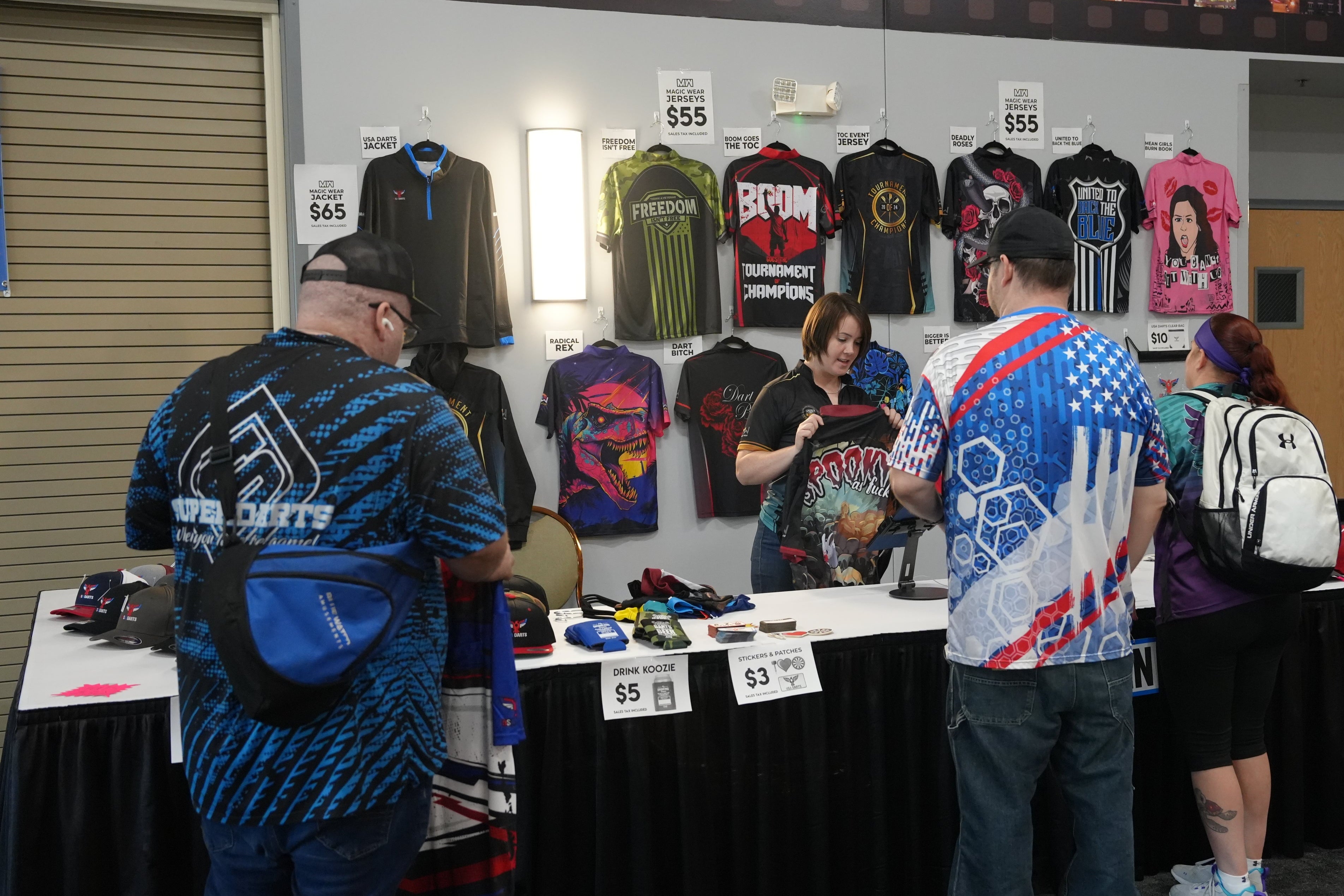 People shopping at the Magic Wear apparel booth during the Tournament of Champions.